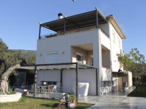 (Αναθεώρηση-) Διαρρύθμιση εσωτερικά και εξωτερικά διώροφης κατοικίας και διαμόρφωση περιβάλλοντος χώρου της στην Μεγάλη Βελανιδιά Αγχιάλου